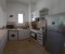 Fully equipped kitchen with washing machine, microwave, toaster and kettle