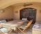 Dining table in the shade with seating area on the terrace