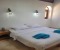 Bedroom 4 with double bed and en-suite bathroom with shower