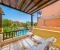 Spacious terrace with sunbdes and pool view. 