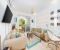 Living room with work space and kitchen counter