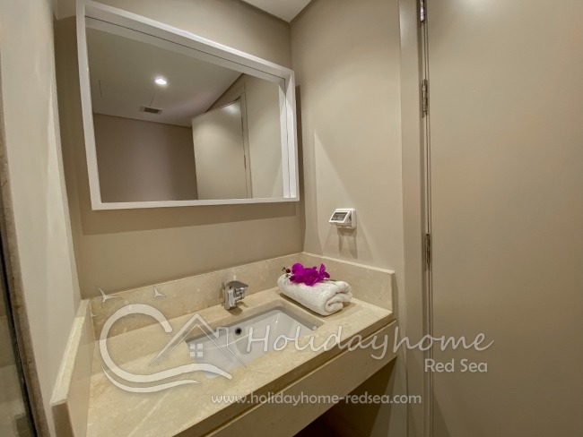Bathroom with large mirror