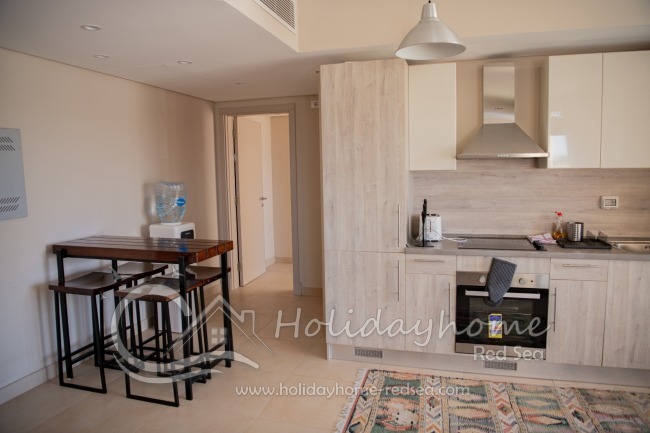 Fully equipped Kitchen with water dispenser, and dining table