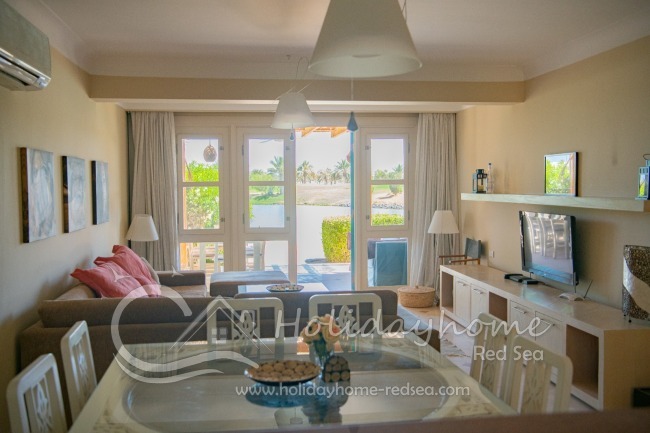 Cozy living room with large sofa and large TV