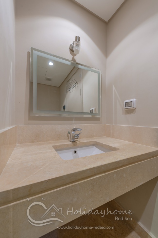 Bathroom with large mirror