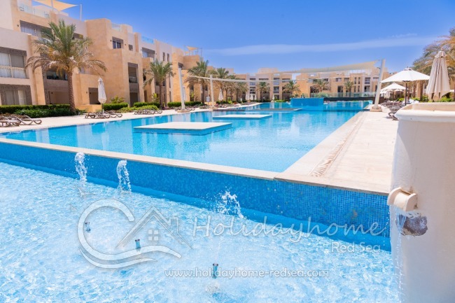 Large shared pool with sun loungers