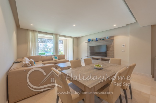 Living room with access to terrace and pool