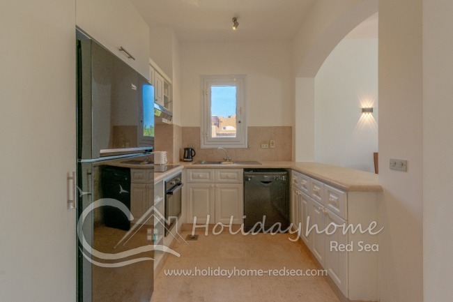 Fully equipped kitchen with washing machine, microwave, toaster, oven, dishwasher and kettle