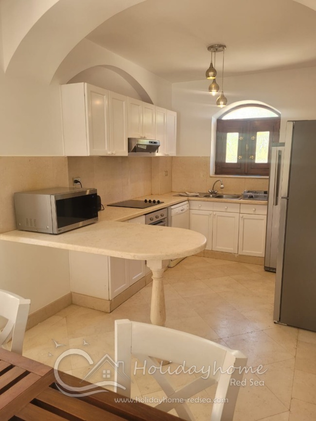 Fully equipped kitchen with microwave, kettle, fridge and separate freezer