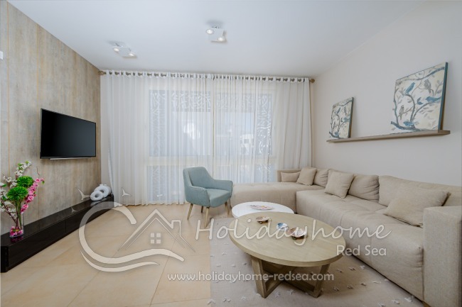 Cozy living room with sitting area and TV