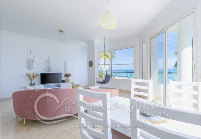 Living room with smart TV and dining table