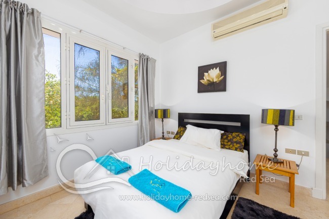 2. bedroom with large windows