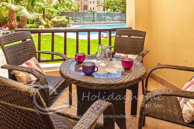 Terrace to the pool with dining space. 