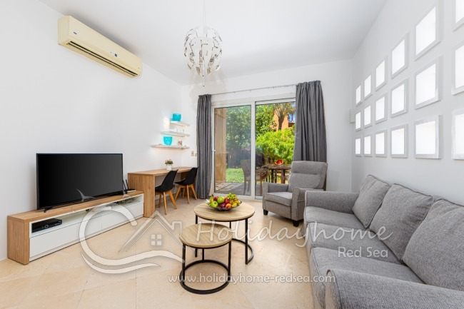 Modern, bright living room with work space