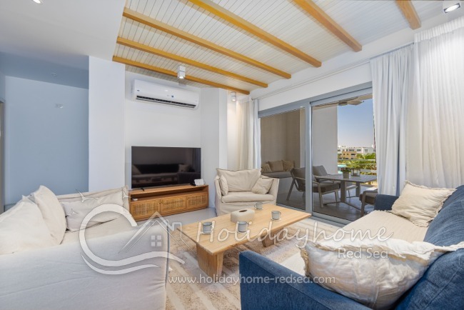 Elegant living room with comfortable sitting area and smart TV