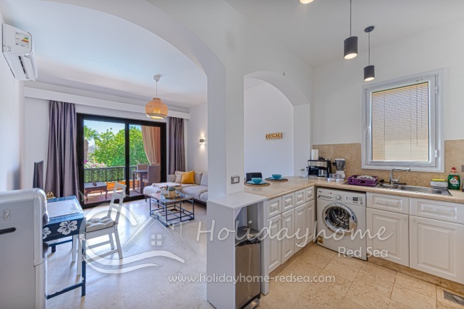 Open kitchen connected to the living room and access to the balcony