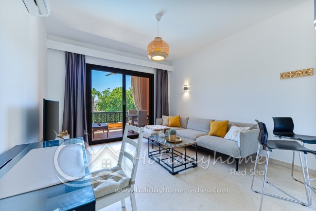 Cozy living room with a large sofa and a workplace for home office