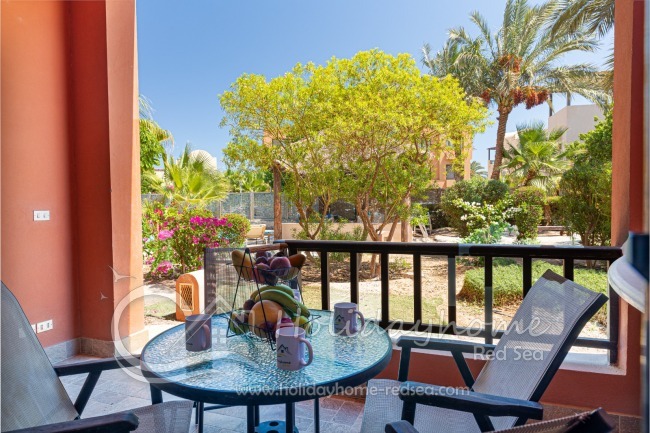 Terrace overlooking the garden and shared pool