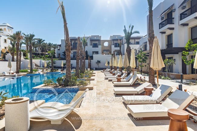 Large Pool with sunbeds and umbrellas