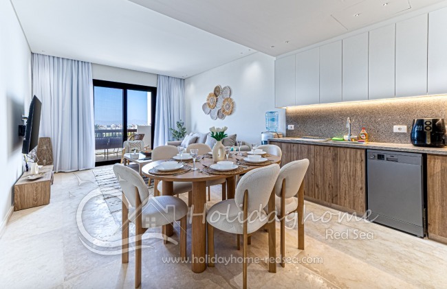 Large, bright living room with open kitchen and dining table