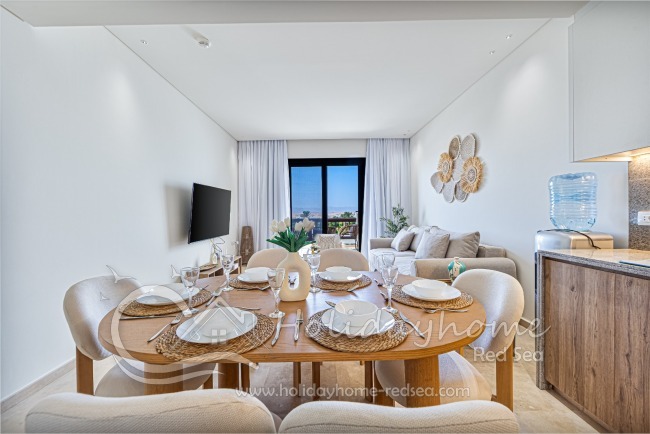 Beautiful dining table with nice living room and wonderful view to the terrace