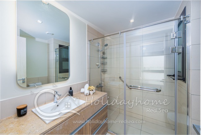 En-suite bathroom with large shower 