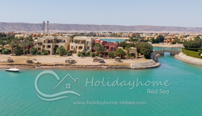 View over the lagoon to the house (red)
