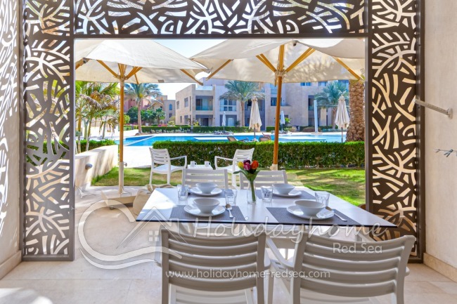 Terrace with sitting area and view to the pool