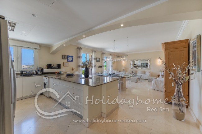 Spacious open-plan kitchen, dining area, and tastefully furnished living room