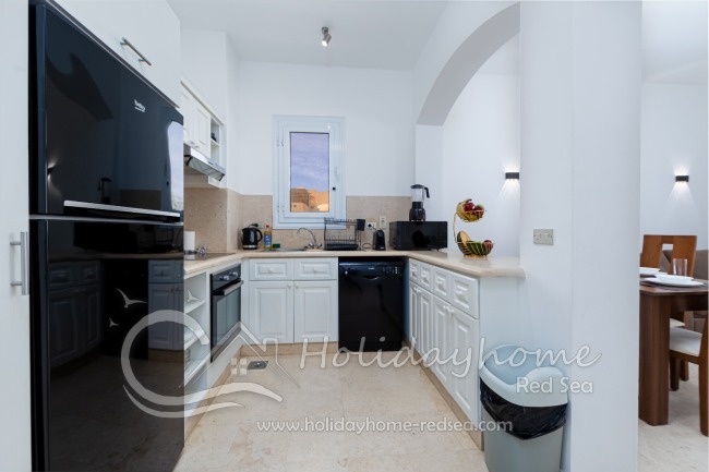 Fully equipped kitchen with washing machine, microwave, toaster, oven, dishwasher and kettle
