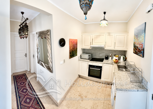 Fully equipped kitchen with washing machine, microwave, toaster, kettle and coffee machine