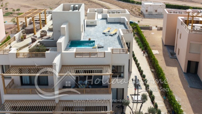 View of the apartment featuring a balcony and a rooftop terrace with a private pool